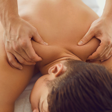Person receiving relaxing shoulder and upper-back massage