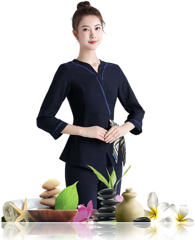 Spa therapist in navy uniform with spa items