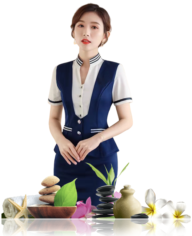 Woman in navy spa uniform with spa items